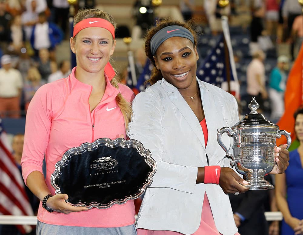 Victoria Azarenka, of Belarus, left, poses with Serena Williams after losing to her during the women's singles final of the 2013 US Open tennis tournament.