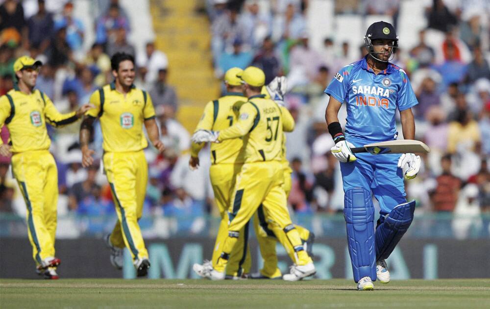 Yuvraj Singh leaves ground after his dismissal during the 3rd ODI cricket match against Austrailia at PCA stadium in Mohali.