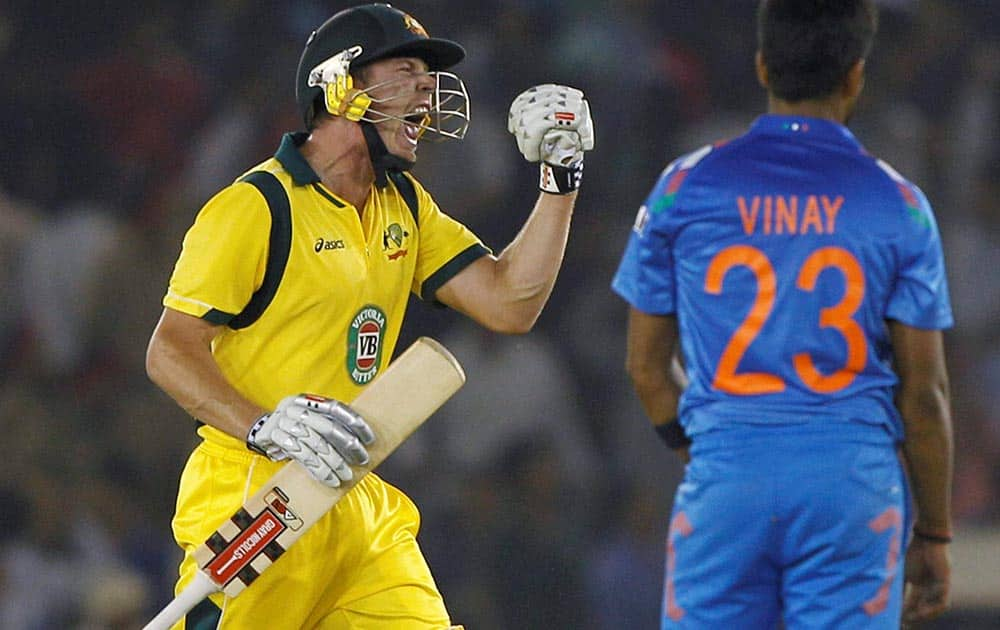 Australian batsman Faulkner reacts after hitting the winning shot against India during the 3rd ODI at PCA stadium in Mohali.