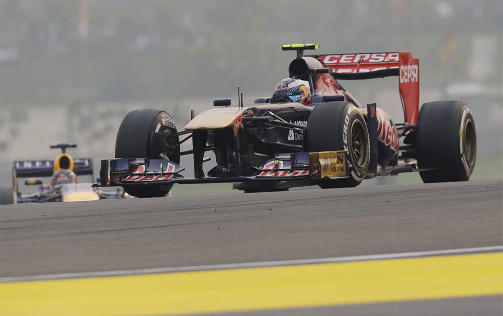 Toro Rosso driver Daniel Ricciardo of Australia steers his car during the Indian Formula One Grand Prix at the Buddh International Circuit in Noida.