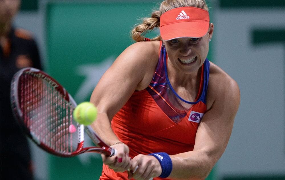 Angelique Kerber of Germany returns a shot to Petra Kvitova of Czech Republic during their tennis match at the WTA Championship in Istanbul, Turkey.