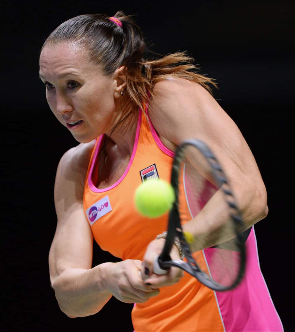 Jelena Jankovic of Serbia returns a shot to Sara Errani of Italy during their tennis match at the WTA Championship in Istanbul, Turkey.