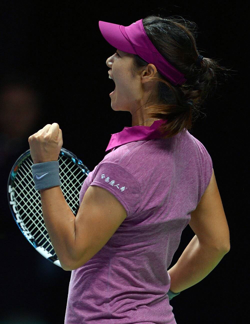 Li Na of China shouts after defeating Petra Kvitova of Czech Republic during their semifinal tennis match at the WTA Championship in Istanbul, Turkey.