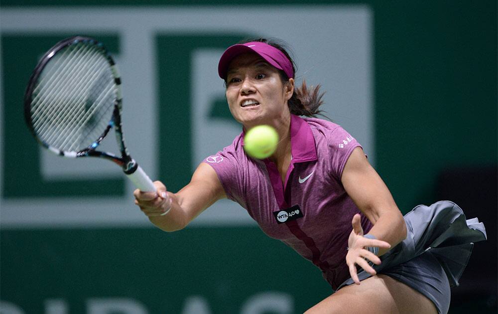 Li Na of China returns a shot to Serena Williams of the U.S during their final tennis match at the WTA Championship in Istanbul, Turkey.