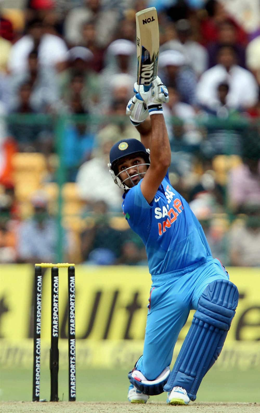 Rohit Sharma plays a shot during the 7th ODI cricket match against Australia at Chinnaswamy stadium in Bengaluru.