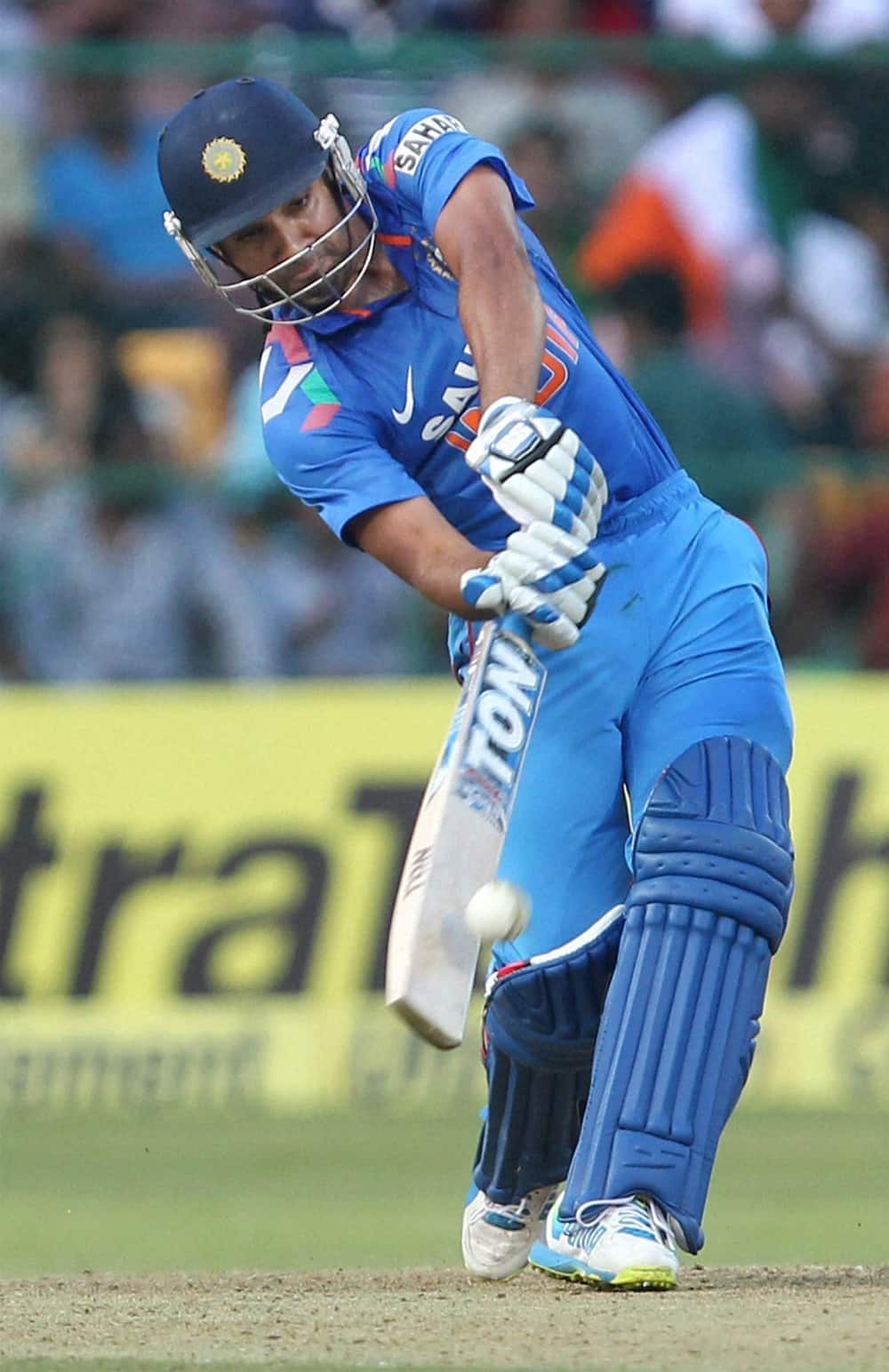 Rohit Sharma plays a shot during the 7th ODI cricket match against Australia at Chinnaswamy stadium in Bengaluru.