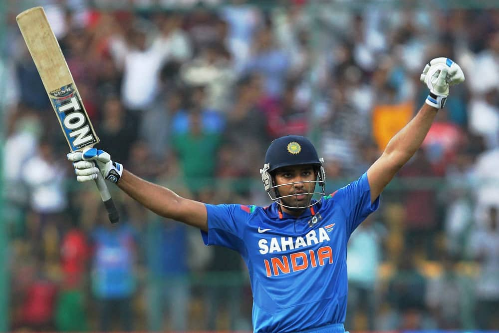 Rohit Sharma celebrates his double century during the 7th ODI against Australia at Chinnaswamy stadium in Bengaluru.