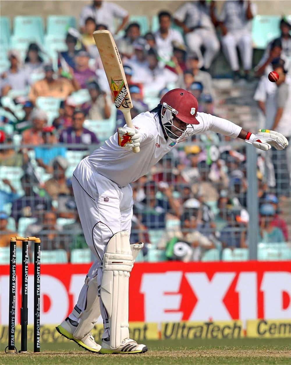 Chris Gayle bats during the first test match between India and West Indies at Eden Garden in Kolkata.