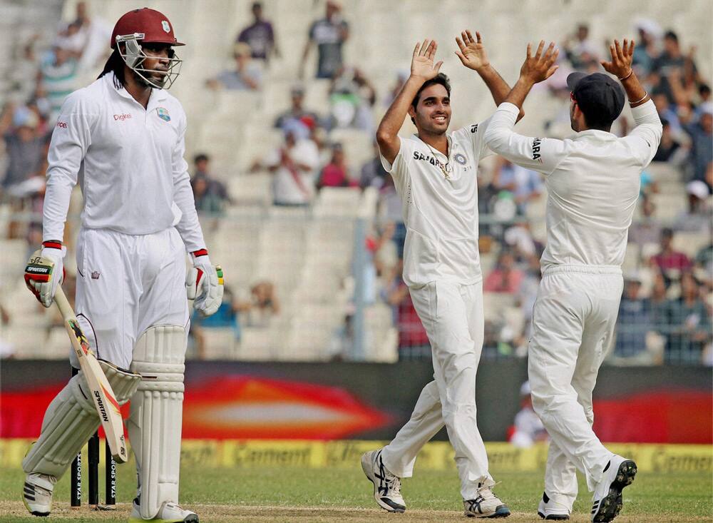 Bhubaneswar Kumar celebrates after dismissing West Indies opener Chris Gayle at Eden Garden in Kolkata.