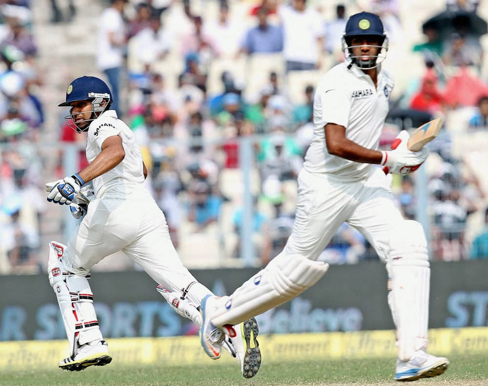 Rohit Sharma and R Ashwin in action on the 2nd day of the first test match at Eden Garden in Kolkata.