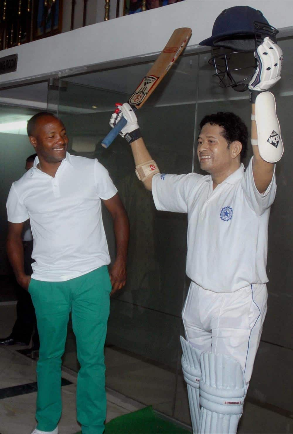 Former West Indian cricketer Brian Lara looking at the wax statue of Master Blaster Sachin Tendulkar at Eden Gardens in Kolkata.