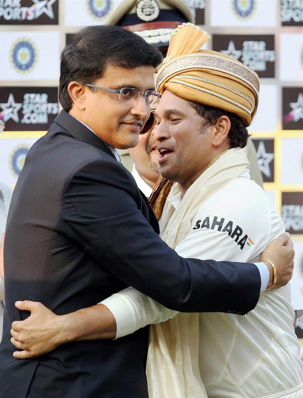 Master blaster Sachin Tendulkar is greeted by former captain Sourav Ganguly at the presentation ceremony after the end of the first Test match against West Indies at Eden Garden in Kolkata.