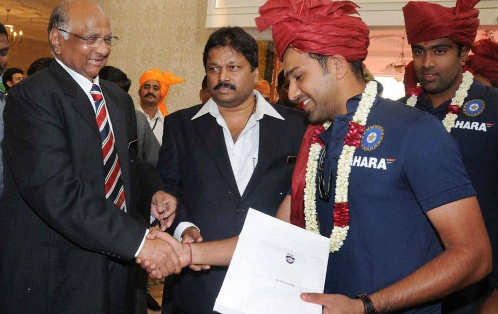 MCA, President Sharad Pawar(L) with Rohit Sharma, R Ashvin during the Mumbai Cricket Association's Sachin Tendulkar Gymkhana naming function at Kandivali, North Mumbai.