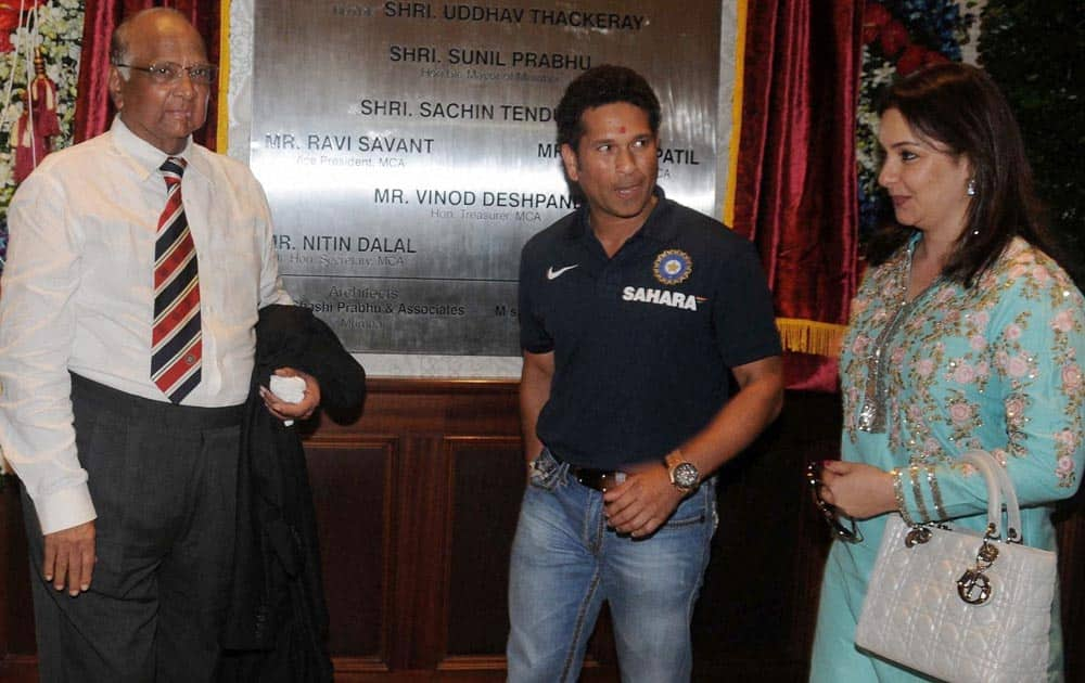 MCA, President Sharad Pawar (L) with Sachin Tendulkar and his wife Anjali (R) during the Mumbai Cricket Association's Sachin Tendulkar Gymkhana naming function at Kandivali, North Mumbai.