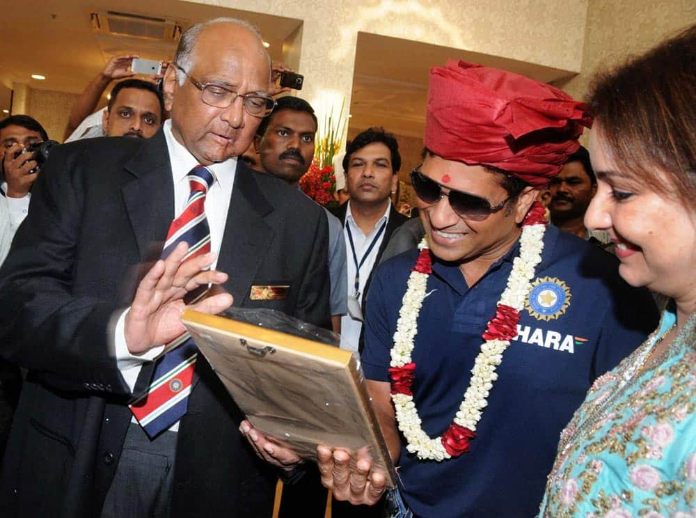 MCA, President Sharad Pawar (L) with Sachin Tendulkar and his wife Anjali (R) during the Mumbai Cricket Association's Sachin Tendulkar Gymkhana naming function at Kandivali, North Mumbai.