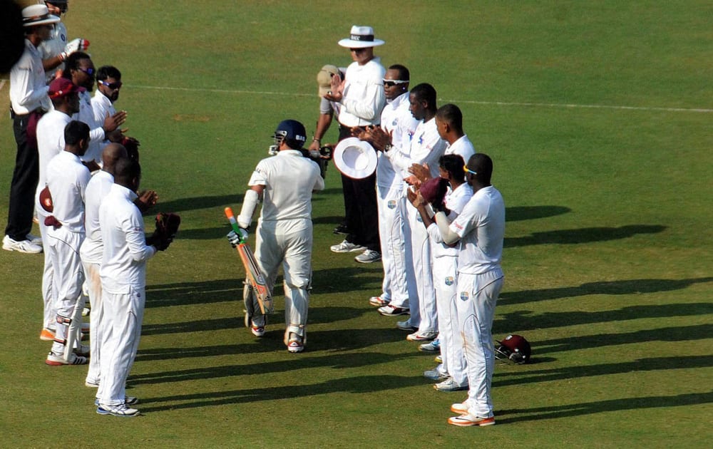 Sachin Tendulkar walks to bat amid a guard of honour on Day 1 of the 2nd test match against West Indies at Wankhede Stadium in Mumbai.