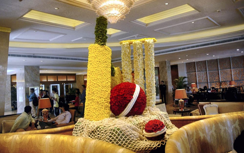 A view of Hotel Taj Mahal Palace lobby where a cricket bat, ball and stumps, made of flowers, are arranged in the honour of cricketer Sachin Tendulkar's last test, in Mumbai.