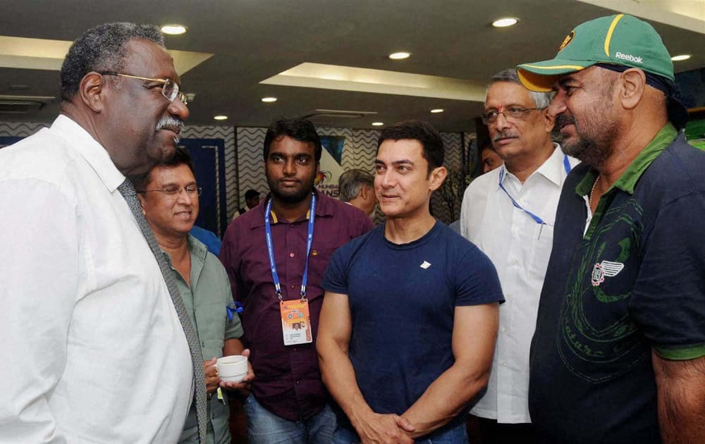 Former West Indies Captain Clive Lloyd (L) along with former test players Kiran More (L) and Balwinder Sandhu (R) actor Amir Khan during the India vs West Indies 2nd Test Match at the Wankhede Stadium in Mumbai.