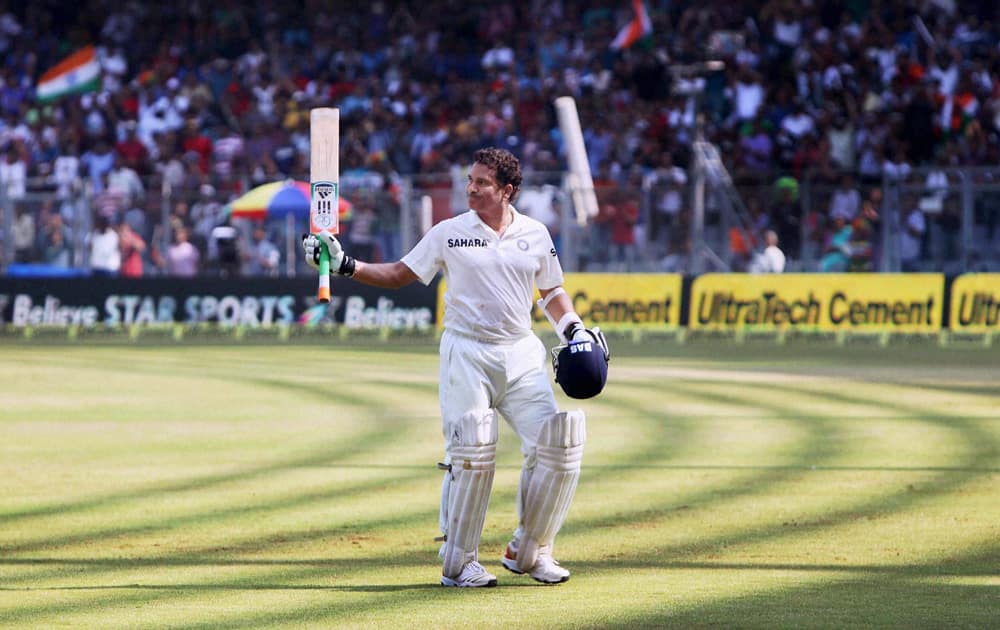 Master blaster Sachin Tendulkar acknowledges the affection and support of the spectators as he walks off the field after his dismissal on Day 2 of the final Test match against West Indies at Wankhede Stadium in Mumbai.