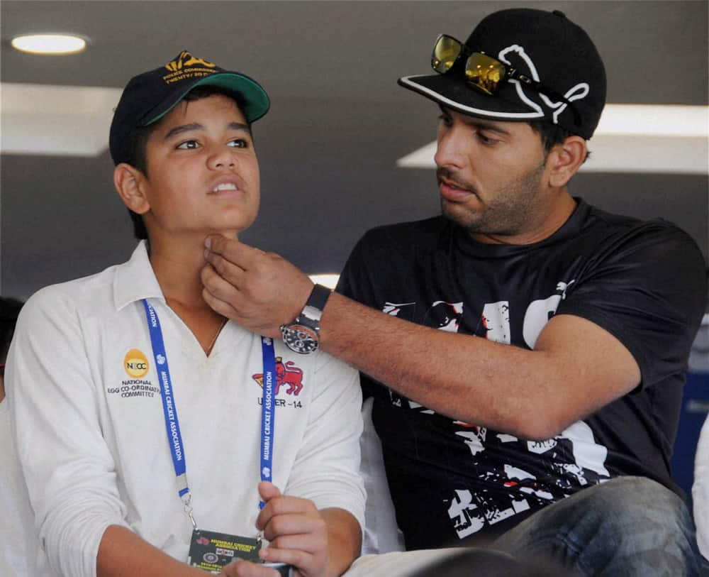 Yuvraj Singh and Sachin Tendulkar's son Arjun at Wankhede Stadium on Day 2 of the final Test match between India and West Indies in Mumbai.