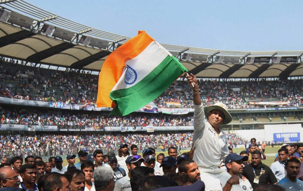 Master Blaster Sachin Tendulkar waves the tri-colour during his farewell ceremony at Wankhede stadium in Mumbai.