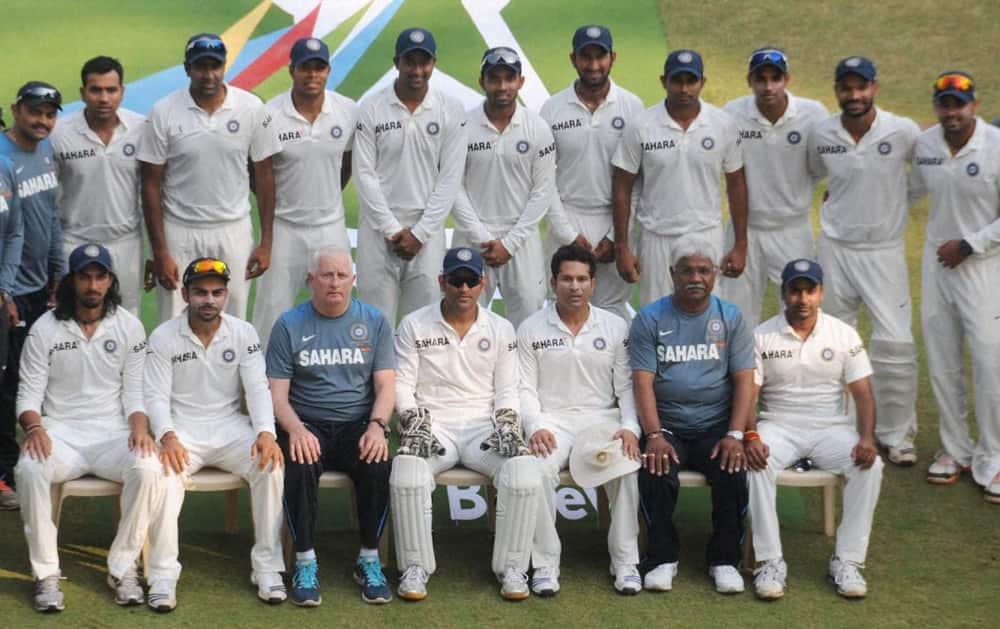 Indian cricket team poses for a group photo before the start of day's play during the test match against West Indies in Mumbai.