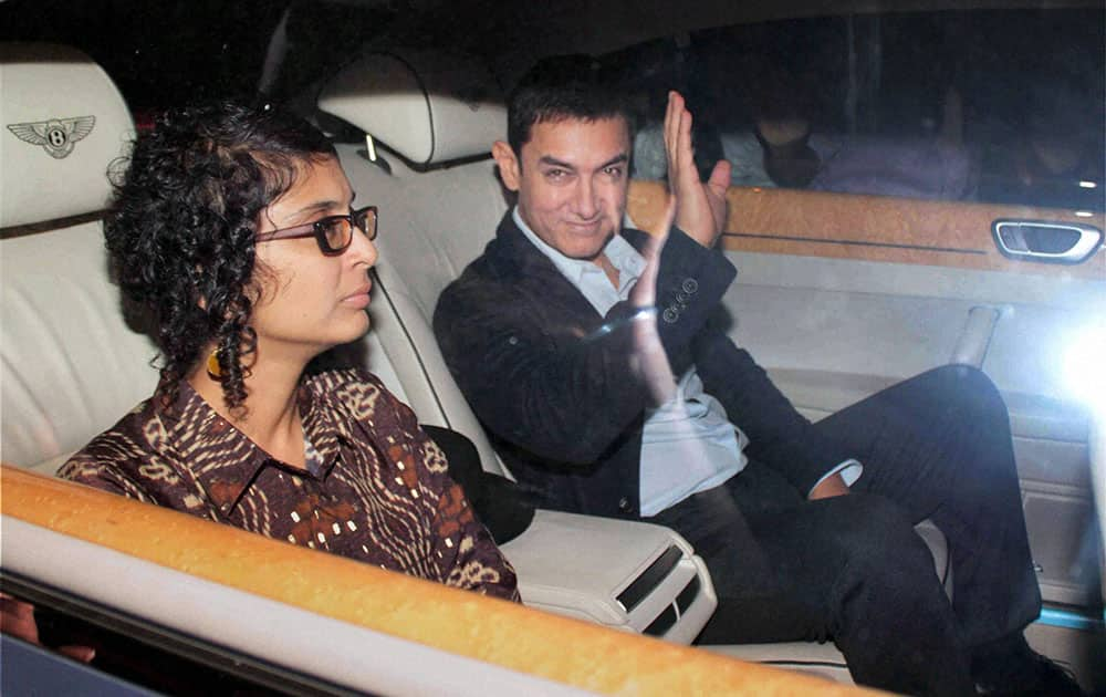 Bollywood actor Aamir Khan with wife Kiran on the way to attend a farewell party hosted by Sachin and Anjali Tendulkar in Mumbai.