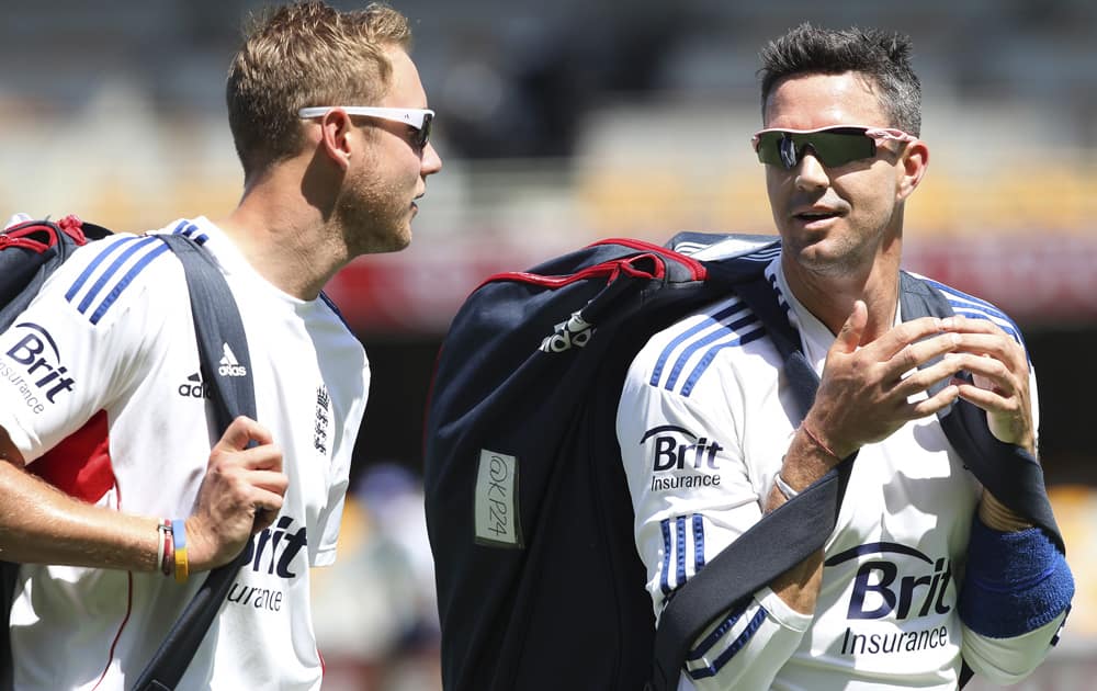 Stuart Broad talks to fellow team member Kevin Pietersen during the final training session on the eve of the first test in the Ashes Series between England and Australia, in Brisbane, Australia.