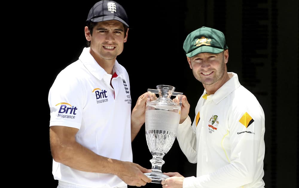 England captain Alastair Cook and Australian captain Michael Clarke pose with the Ashes Trophy on the eve of the first test in the Ashes Series between England and Australia, in Brisbane, Australia.