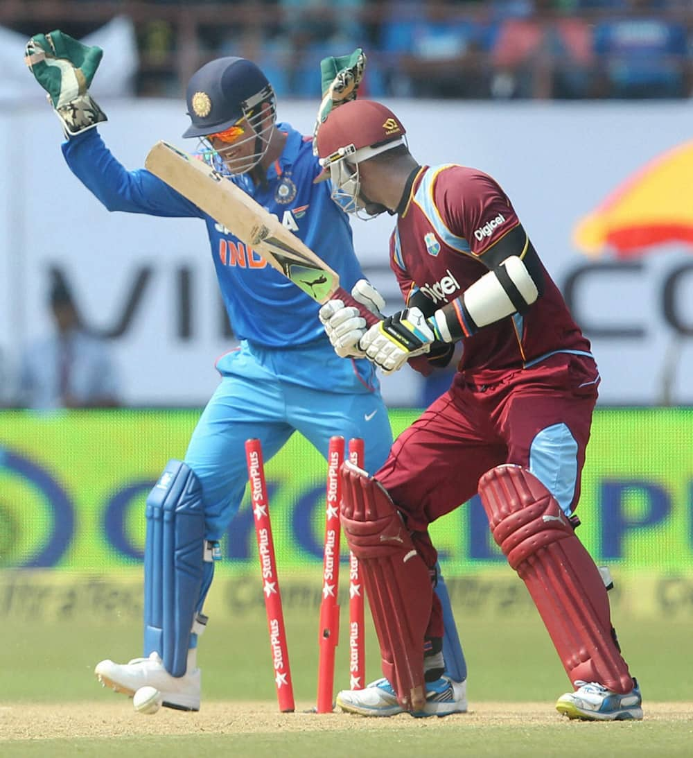 Marlon Samuels of West Indies is bowled during the 1st ODI cricket match against India in Kochi.