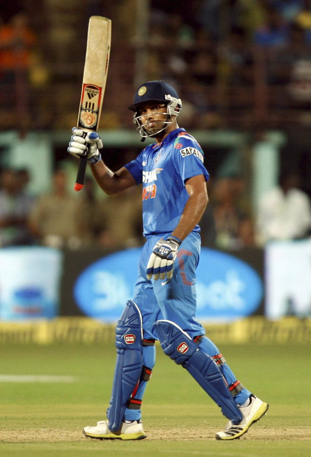 Rohit Sharma celebrate his fifty runs against West Indies during the 1st ODI in Kochi.