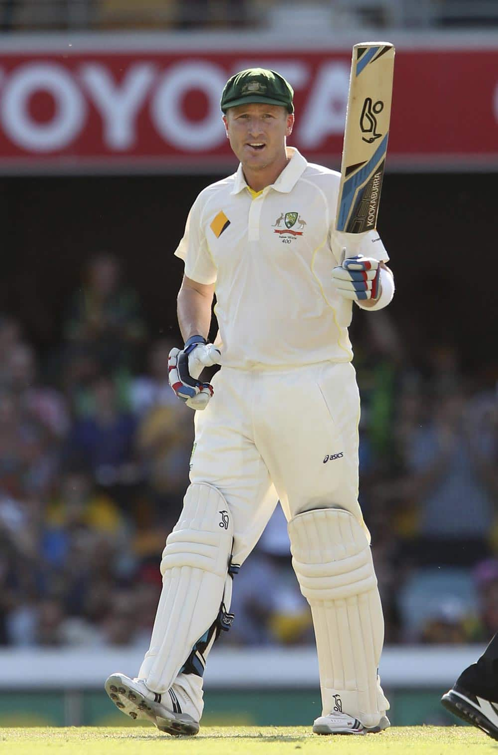 Australia's Brad Haddin salutes the crowd as he reaches 50 runs on the first day of the series-opening Ashes cricket test between England and Australia at the Gabba in Brisbane, Australia.