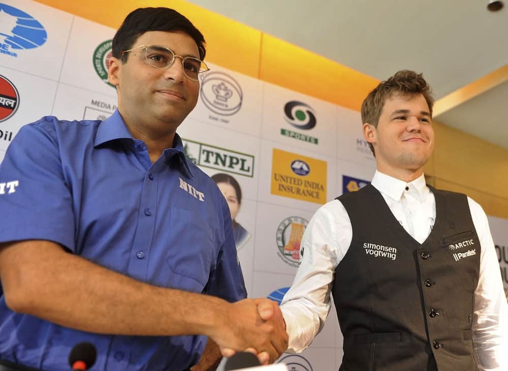 Reigning world chess champion India’s Viswanathan Anand, left and world's top-ranked player Norway's Magnus Carlsen pose for the media at a press conference ahead of the FIDE World Chess Championship in Chennai.