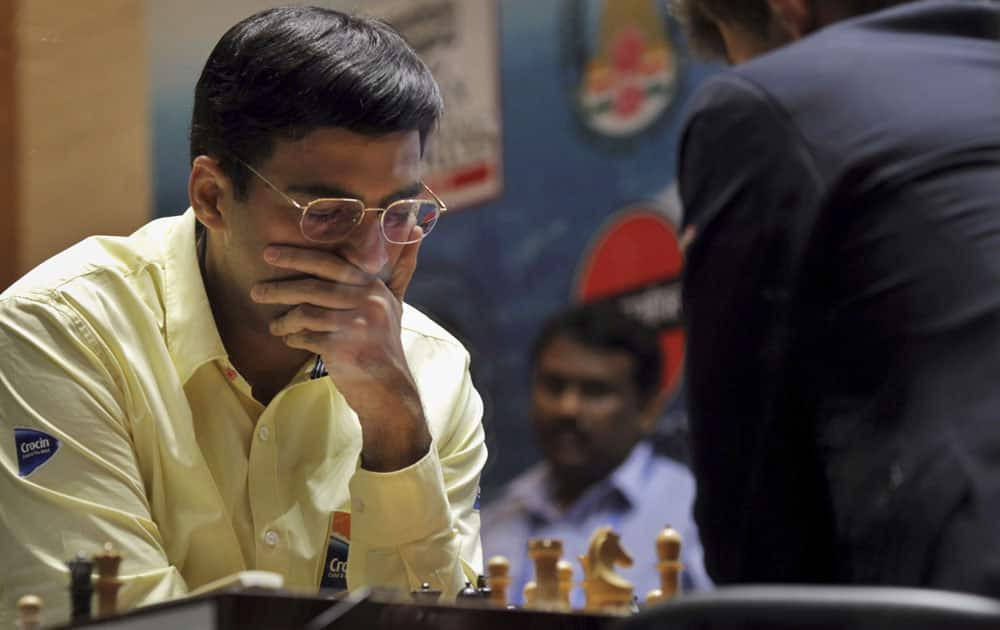 Reigning world chess champion India’s Viswanathan Anand, left, thinks over his move as he plays against Norway’s Magnus Carlsen during the Chess World Championship match in Chennai.