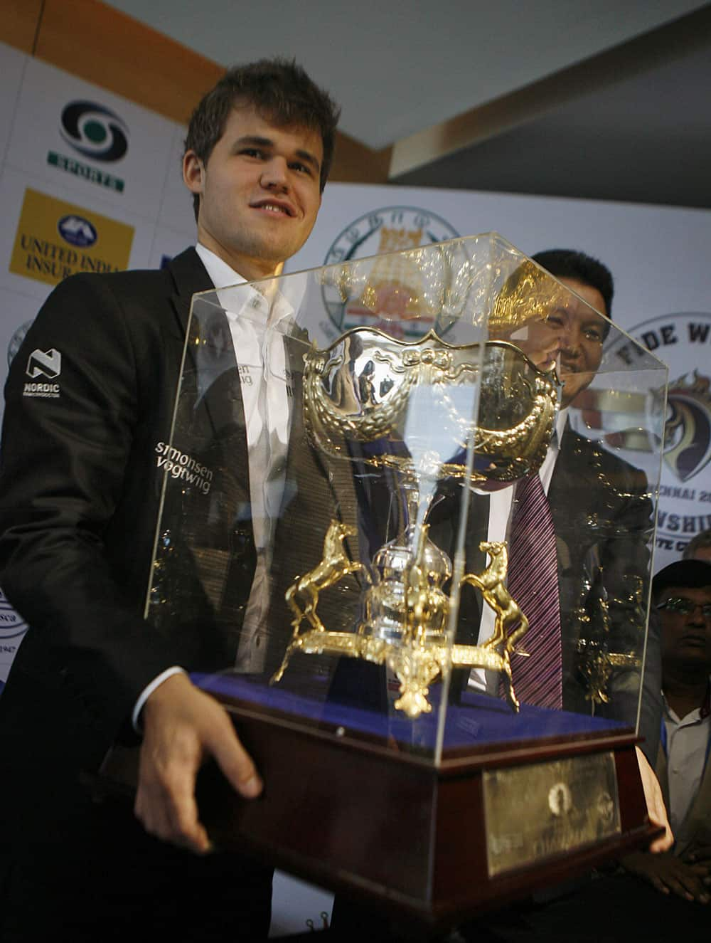 New world chess champion Norway’s Magnus Carlsen receives a trophy during a ceremony of the FIDE World Chess Championship, in Chennai.