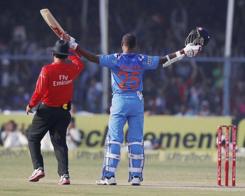 Shikar Dhawan celebrates his century during the last ODI cricket match against West Indies at Green Park Stadium in Kanpur.