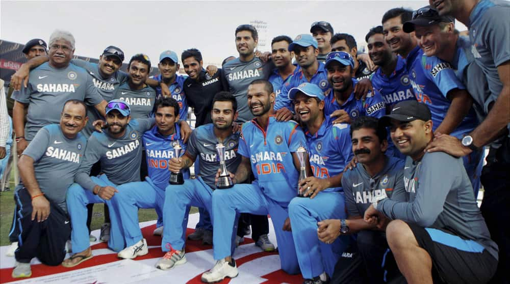 Indian team players jubilate with winner's trophy at the presentation ceremony after the last ODI cricket match against West Indies, at the Green Park stadium in Kanpur. India won the match to win the series 2-1.