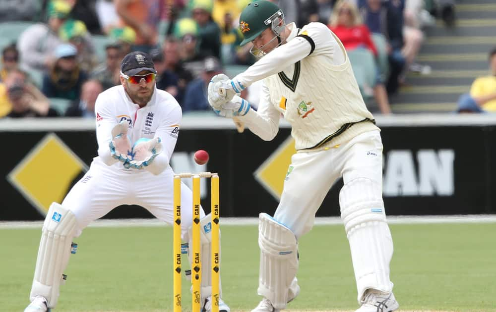 Michael Clarke cuts the ball in front of England's Matt Prior during the second Ashes cricket test match between England and Australia, in Adelaide, Australia.