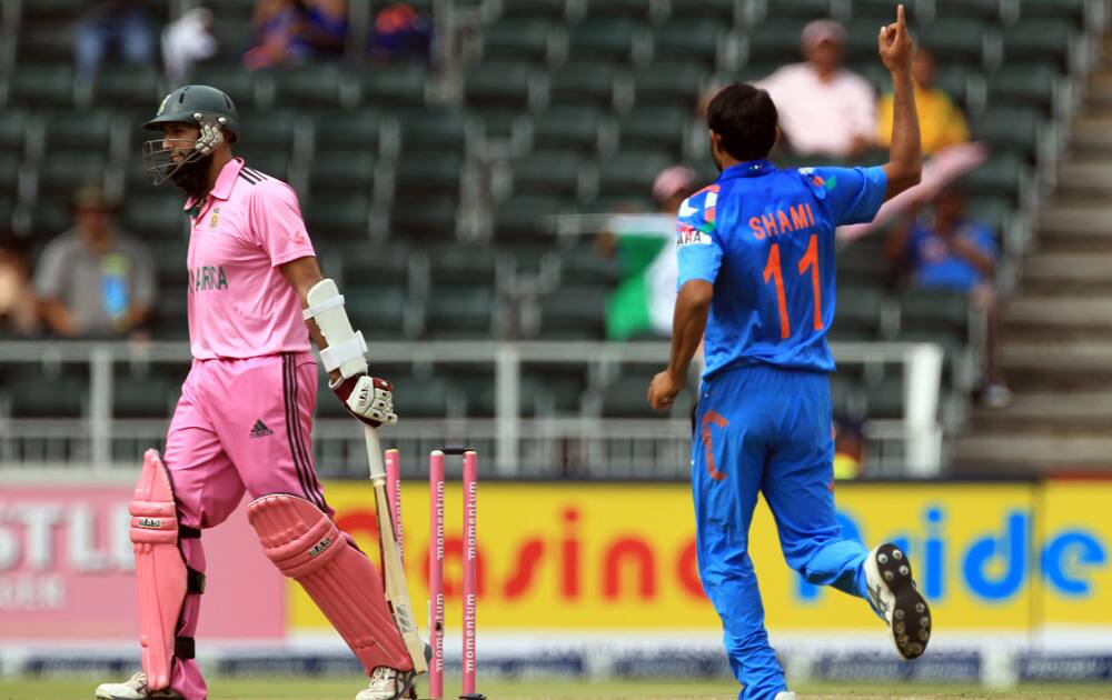Hashim Amla leaves the crease after bowled by Mohammad Shami during their 1st One Day International cricket match at Wanderers stadium in Johannesburg, South Africa.