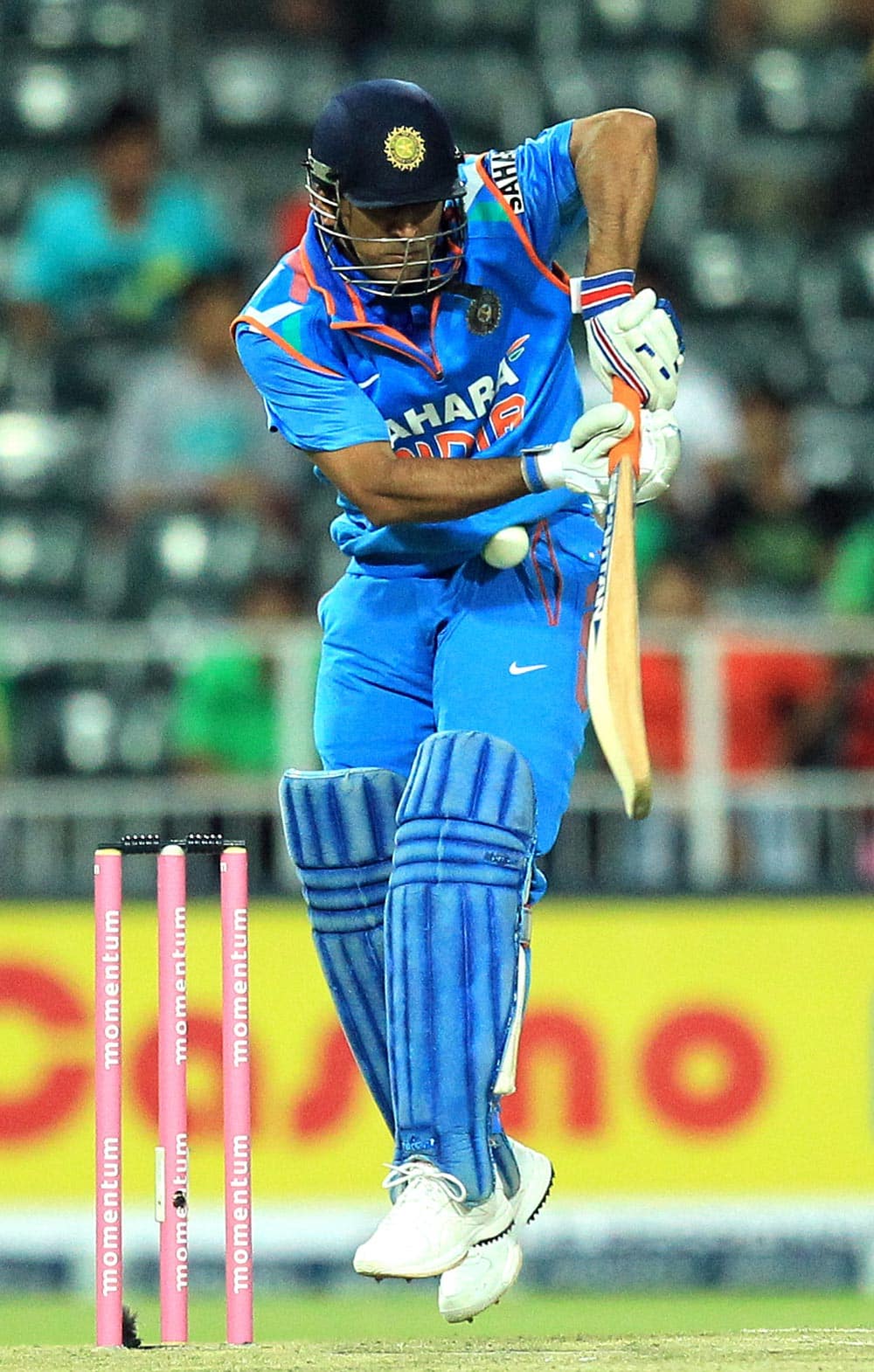 India's captain Mahendra Singh Dhoni, misplays a bouncer during their 1st One Day International cricket match against South Africa at Wanderers stadium in Johannesburg, South Africa.