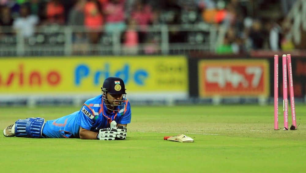 India's batsman Suresh Raina, lies on the pitch after being run out for 14 runs during their 1st One Day International cricket match against South Africa at Wanderers stadium in Johannesburg, South Africa.