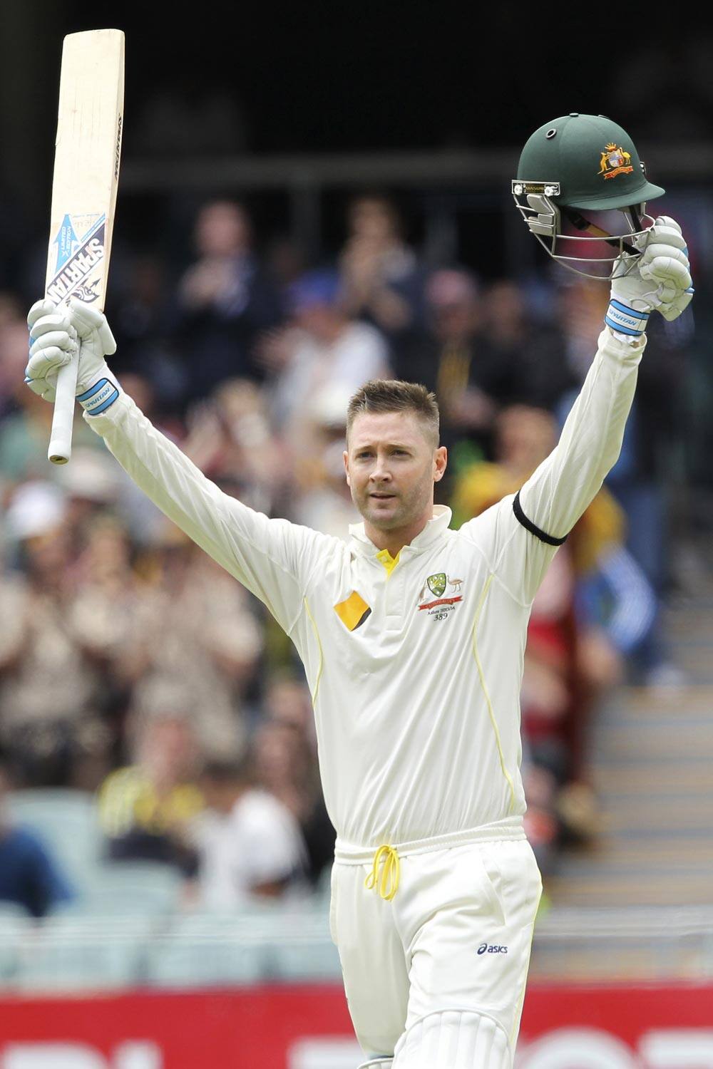 Australia's Michael Clarke celebrates scoring a century during the second Ashes cricket test match between England and Australia.