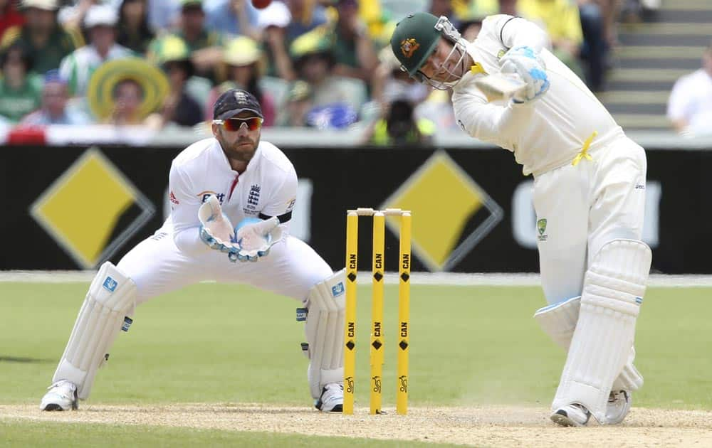 Australia's Michael Clarke drives the ball in front of England's Matt Prior during the second Ashes cricket test match between England and Australia, Adelaide, in Australia.