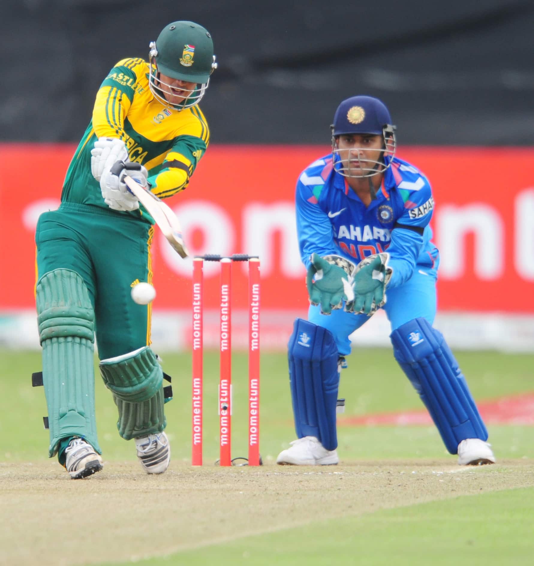 South Africa's Quinton de Kock, left, drives a ball during their second one day international against India in Durban, South Africa.