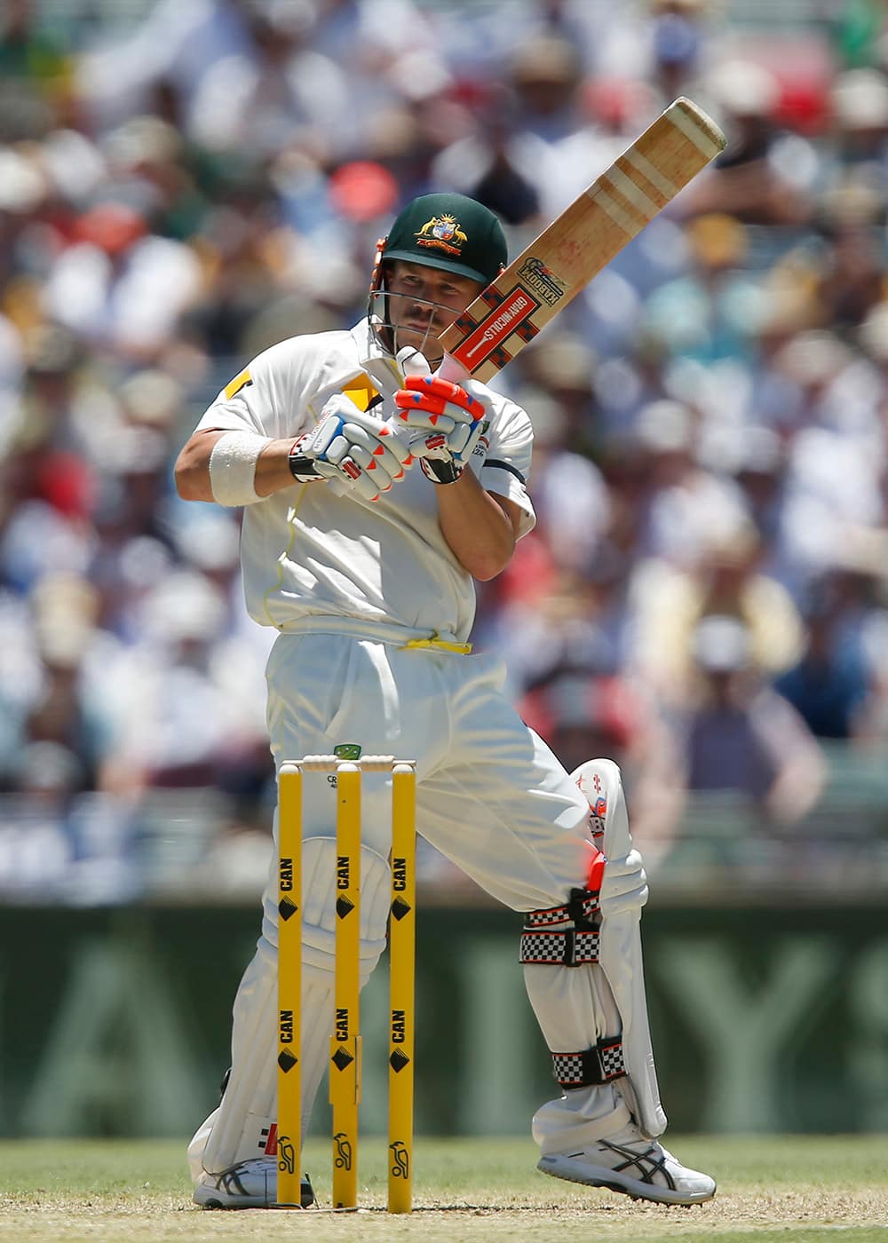 Australia's Dave Warner plays a hook shoot on the first day of the Ashes cricket test match against England in Perth, Australia.