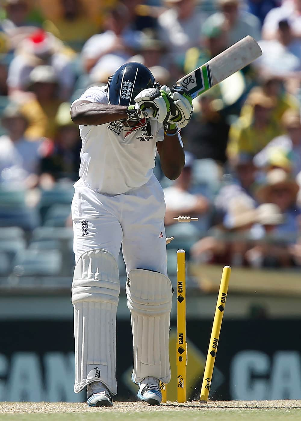 England's Michael Carberry is bowled by Australia's Ryan Harris for 43 runs on the second day of their Ashes cricket test match against Australia in Perth, Australia.