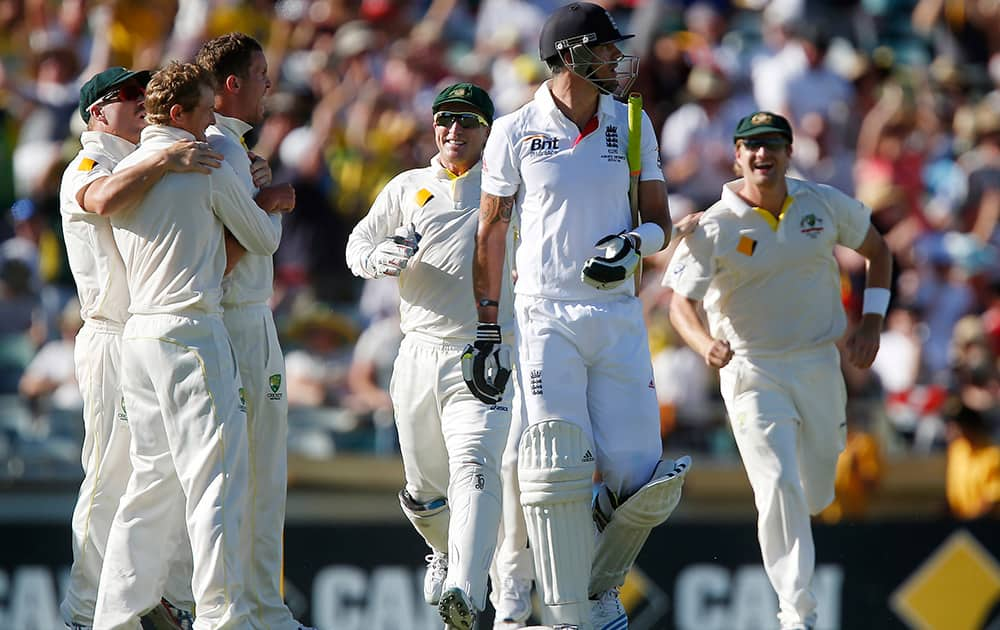 England's Kevin Pietersen walks back to the pavilion after being caught out for 19 runs on the second day of their Ashes cricket test match against Australia in Perth, Australia.