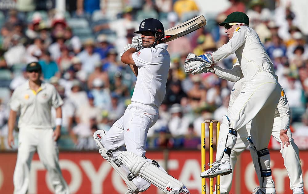 England's Alastair Cook plays a cut shot against Australia during his innings of 72 runs on the second day of their Ashes cricket test match in Perth, Australia.