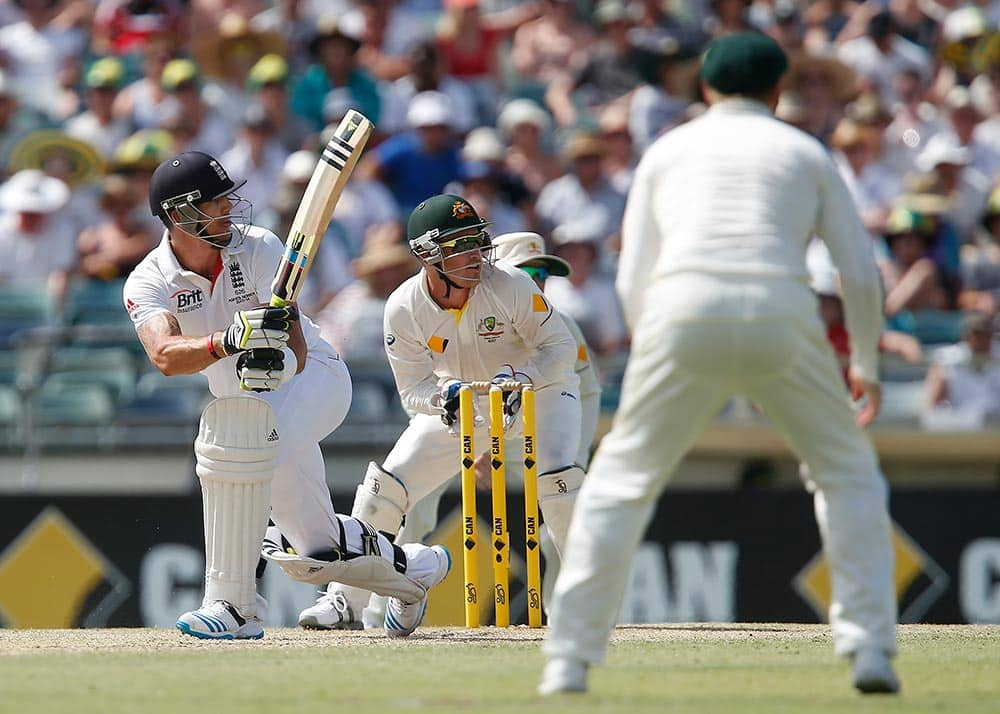 England's Kevin Pietersen, left, plays a sweep shot during England's second innings on the fourth day of their Ashes cricket test match against Australia in Perth, Australia.