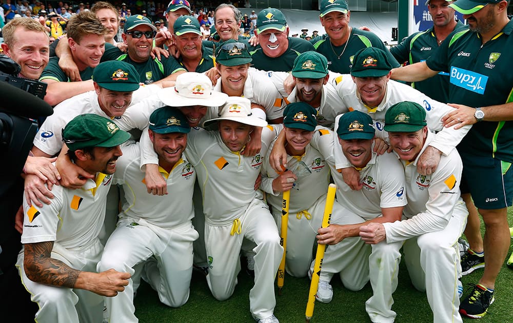 Australian team poses for group photo after winning their Ashes cricket test match over England in Perth, Australia.